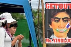 Defiant Thai protesters besiege government buildings