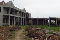 Students study in old warehouses in Hanoi as planned schools still not built