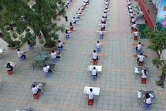 Students take exam in playground in HCM City
