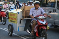 Old man collects clothes for the poor