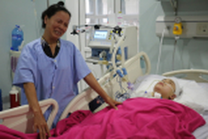 Parents helplessly wait for daughter to awake from coma