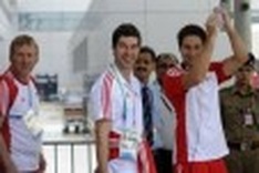 Athletes arrive as Delhi comes under fire
