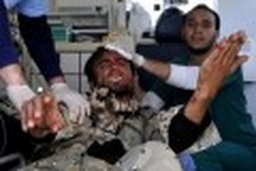 Libya rebels 'seize' Ajdabiya, explosions near Tripoli