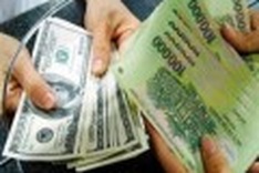 UPDATE 1-Vietnam pulls long-awaited devaluation trigger