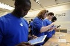 Apple nearly doubles net profit, iPad sales dip