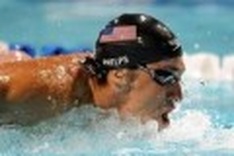 Phelps downs Lochte for backstroke win