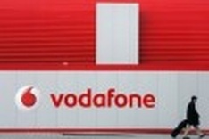 Vodafone profits drop on European debt charge