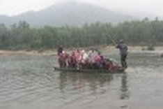Children must wade through a river to go to school