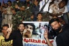 Libya declared free, but Gadhafi death questioned