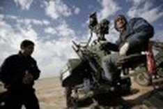 Libya rebel town bombed amid calls for Tripoli demo