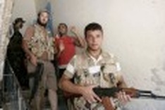 Tripoli calmer as Gadhafi's men pushed out