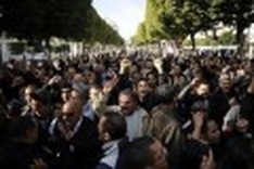 Resignations rock Tunisia as thousands protest