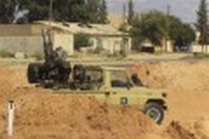 France pursues Libya air strikes, NATO talks