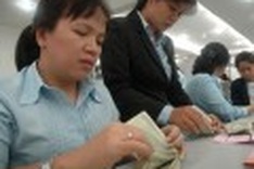 State bank official: Exchange rate adjustment is necessary