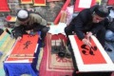 Calligraphy scrolls give blessings for a new year