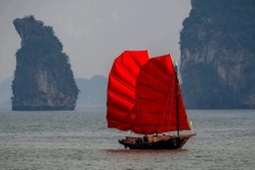 Red-sailed boats turn heads on Ha Long Bay
