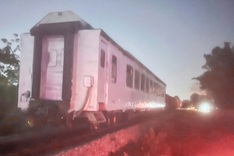 Car hit by train, pushed into ditch in Hanoi