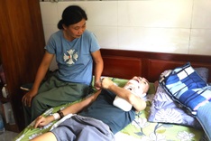 Danang mother seeks help for son left bedridden after crash
