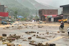 Floods sweep landslide debris into homes in Lao Cai