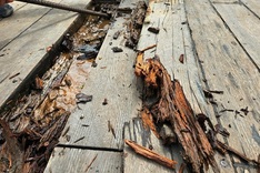 Wooden pedestrian bridge over Huong River deteriorates