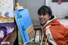 Orphanage girl painting with her mouth moves hearts