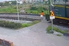 Train hits woman crossing tracks