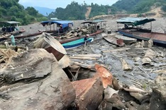 Tonnes of waste and rotten wood clog Nghe An hydropower reservoir