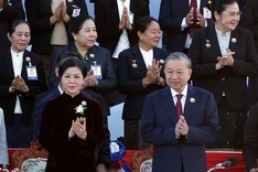 Party General Secretary attends 50th National Day celebration in Laos