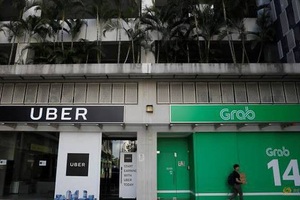 Grab và Uber bị Singapore phạt 9,5 triệu USD vì thương vụ sáp nhập