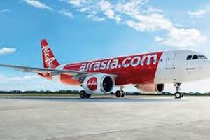 Máy bay Air Asia hạ cánh khẩn cấp xuống Tân Sơn Nhất vì sạc điện thoại phát nổ