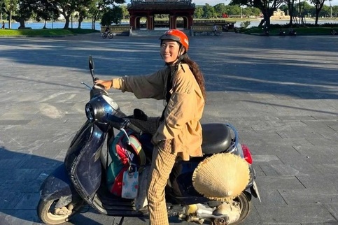 Young Japanese woman motorbikes length of Vietnam alone