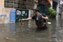 30-minute rain in Hanoi leaves streets deeply flooded