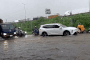 Heavy rain floods Hanoi streets, snarls rush-hour traffic