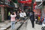 Tourists cleared as Hanoi police move on railway coffee street