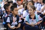 Restructuring cuts public school numbers by half